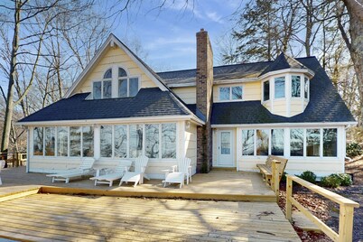 Spacious lakefront home with panoramic views and private beach