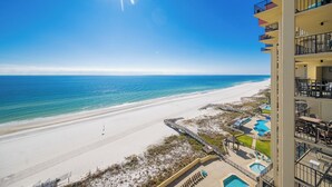 A beachfront hotel with a pool area, a beach, and a clear view of the ocean. - ~ Phoenix III - 3BR Condo (Orange Beach)