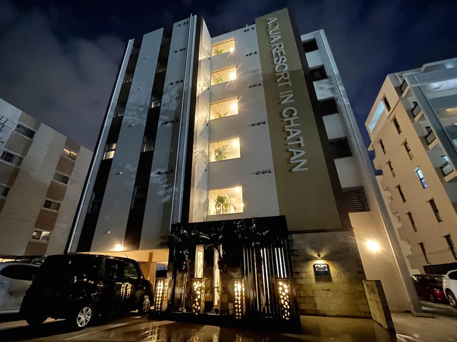 A multi-story building with a sign reading "AJARESORT IN CHATTAN."