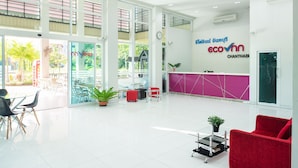 A spacious lobby with a reception desk, seating area, and large windows. - Eco Inn Lite Chanthaburi (Chanthaburi)