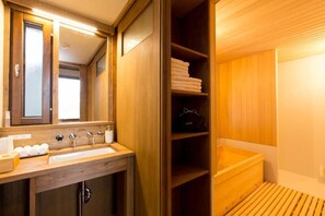 Separate bathtub and shower, free toiletries, hair dryer, bathrobes