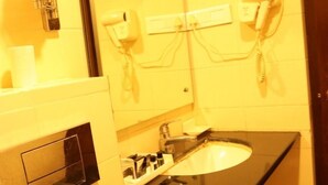 Premium Room, Multiple Beds | Bathroom | Towels - The Dawn Hotel (Mysore)
