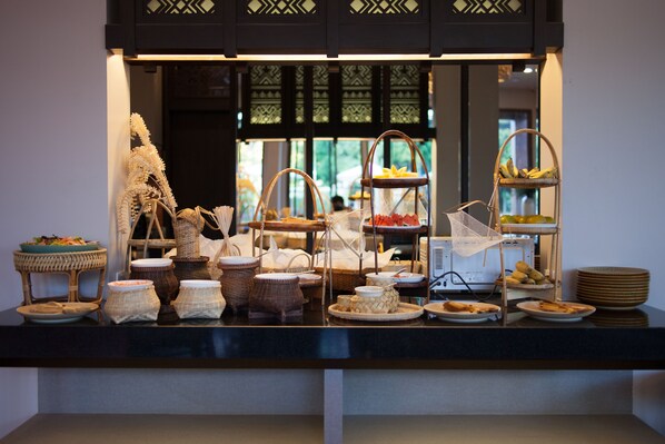 A buffet setup with various dishes and serving ware. - T Heritage Hotel (Chiang Mai)