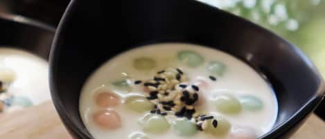 A bowl of dessert with various toppings.