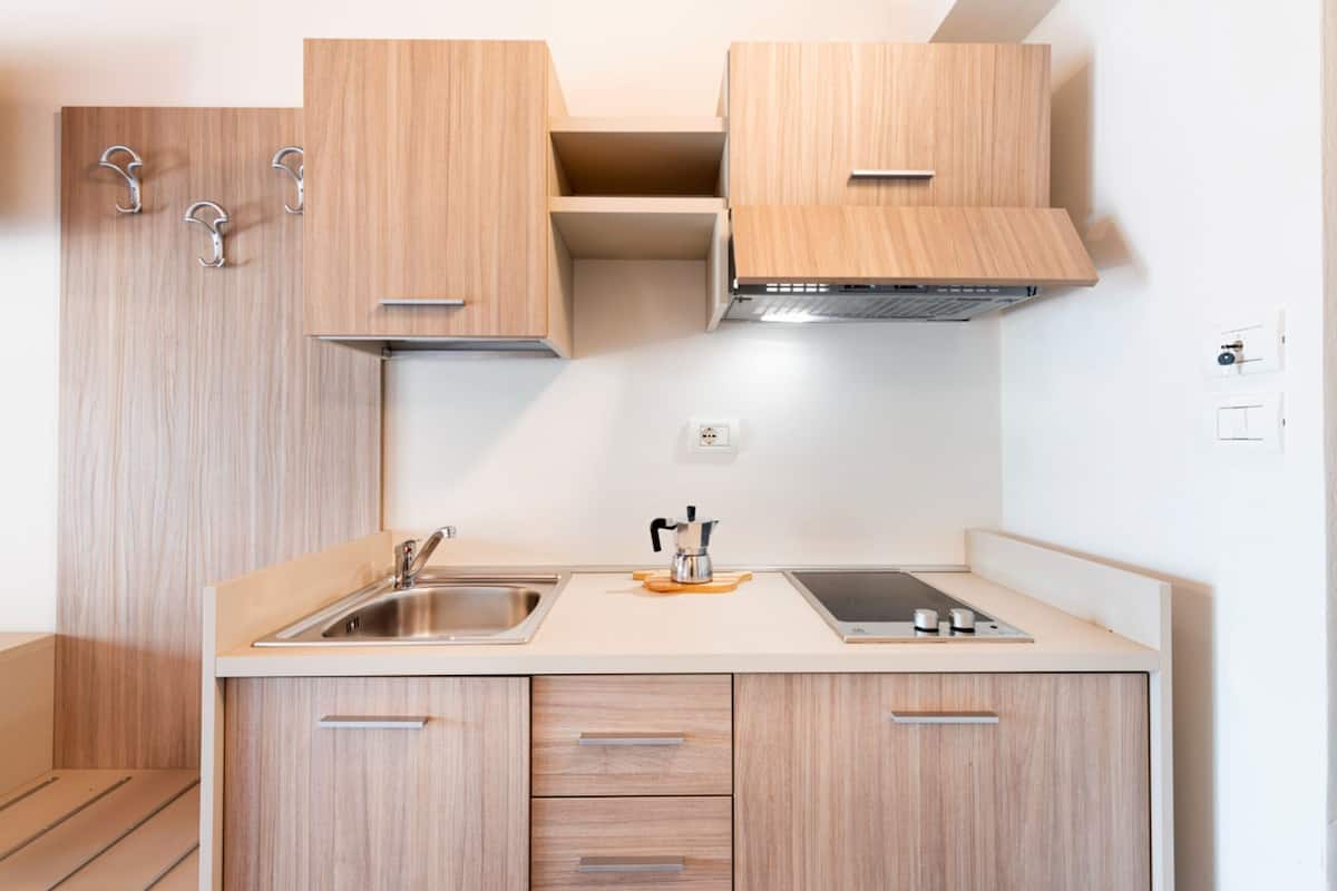 full-sized fridge, stovetop, high chair, cookware/dishes/utensils