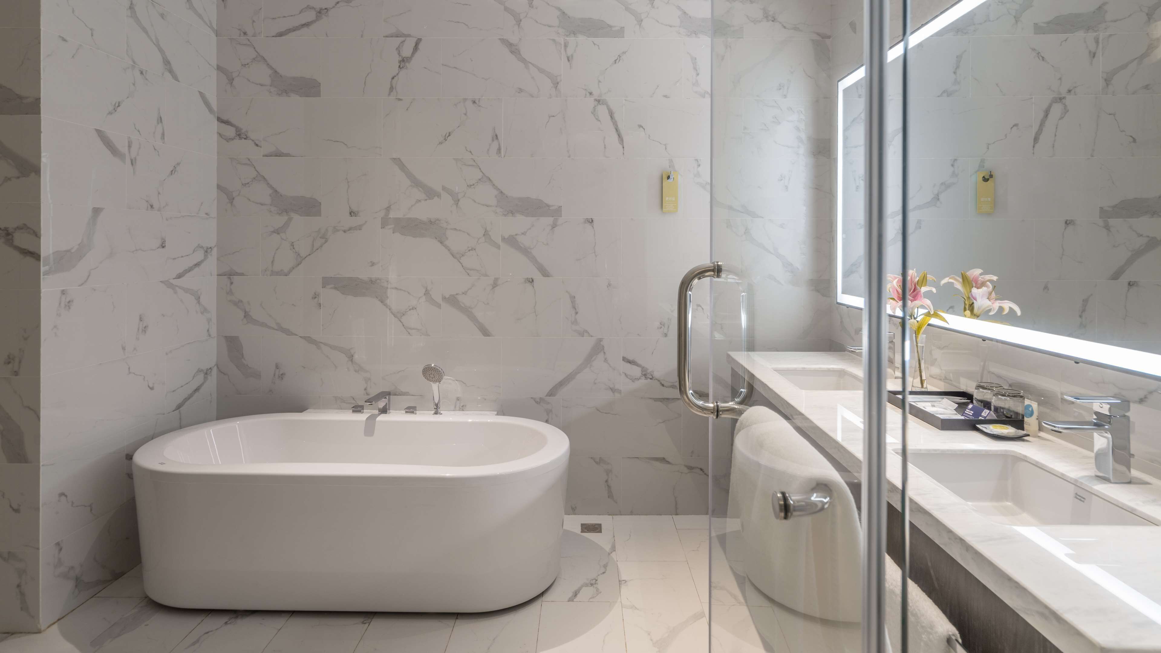 suite, 1 king bed | bathroom | combined shower/bathtub, designer toiletries, hair dryer, slippers