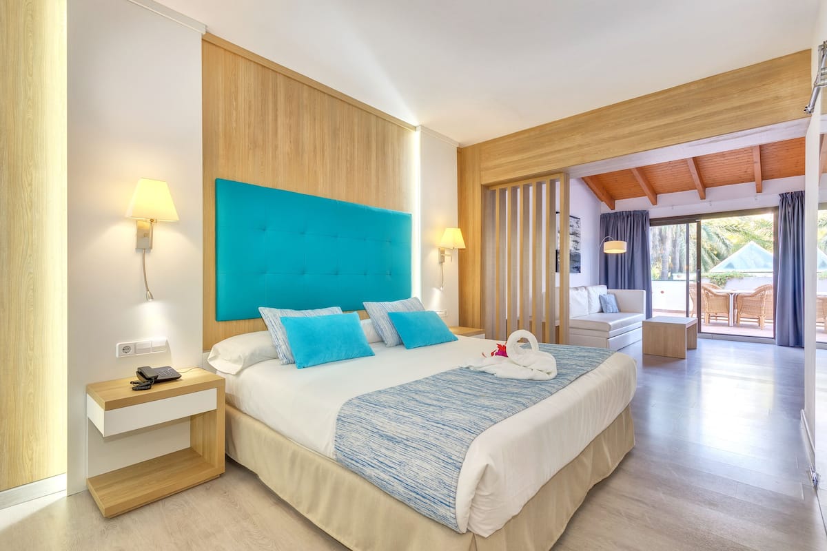 Junior Suite, Balcony | 1 bedroom, desk, laptop workspace, blackout drapes