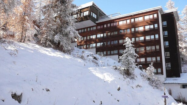 A multi-story building with a modern architectural design, surrounded by snow-covered trees and a snowy landscape. - Ski-In/Ski-Out Apt, 2 Rooms, Mountain Corner, Sleeps 4, Central Vars, Near Slopes & Shops (Vars)