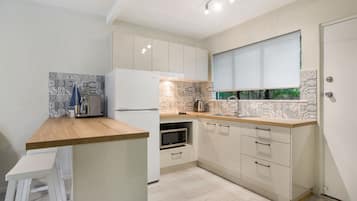 Apartment, 2 Bedrooms | Private kitchen | Full-size fridge, microwave, stovetop, espresso maker