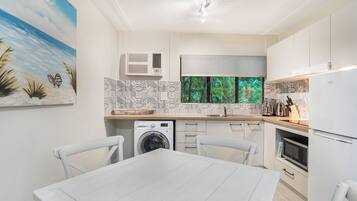 Apartment, 2 Bedrooms | Private kitchen | Full-size fridge, microwave, stovetop, espresso maker