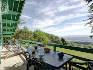A table set outdoors with a scenic view.