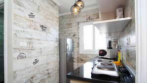 A kitchen with a vintage design, featuring a refrigerator, microwave, and stove. -  Beautiful sea view Apt,in the heart of Alexandria (alexandria)