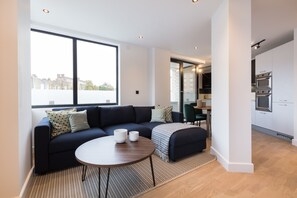 Deluxe Apartment | Living area | 55-inch flat-screen TV with digital channels, TV, Netflix - Kentish Town Apartments by Allo Housing (London)