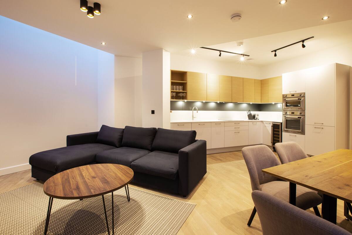 Deluxe Duplex | Living area | 55-inch flat-screen TV with digital channels, TV, Netflix