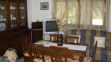 Apartment, Garden View | Living area | TV