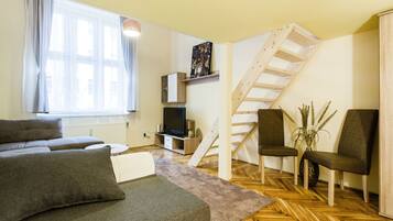 Apartamento, 1 quarto | Área de estar