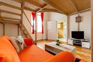 Departamento, 1 habitación | Área de sala de estar