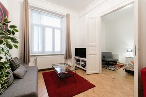 Apartment, 1 Bedroom | Living area | Flat-screen TV