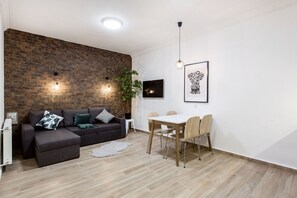 Apartamento, 2 quartos | Área de estar