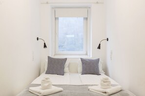 Apartamento, 2 quartos | Wi-Fi de cortesia, roupa de cama