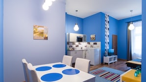 A compact living space with a dining area, kitchenette, and a bed. - Paulay 7 Apartment I. (Budapest)