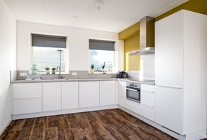 Fridge, microwave, dishwasher, dining tables