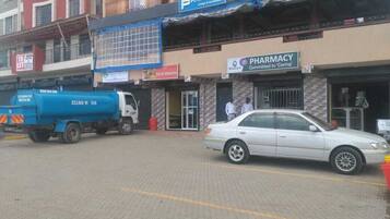 A pharmacy with a sign stating "Committed to Caring."