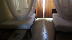 A room with two white beds, a tiled floor, and sheer curtains. - Mash Park Hotel Kisii (Kadongo)