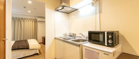 Fridge, microwave, stovetop, cookware/dishes/utensils