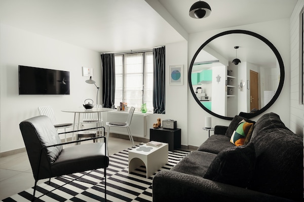 1-BR Deluxe Apartment | Living area | 49-inch Smart TV with cable channels, TV, iPod dock