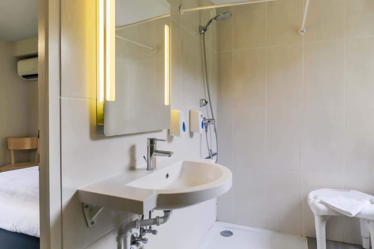 double room, mobility accessible | bathroom | shower, towels, soap, toilet paper