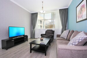 Apartment, 1 Bedroom | Living area | Flat-screen TV