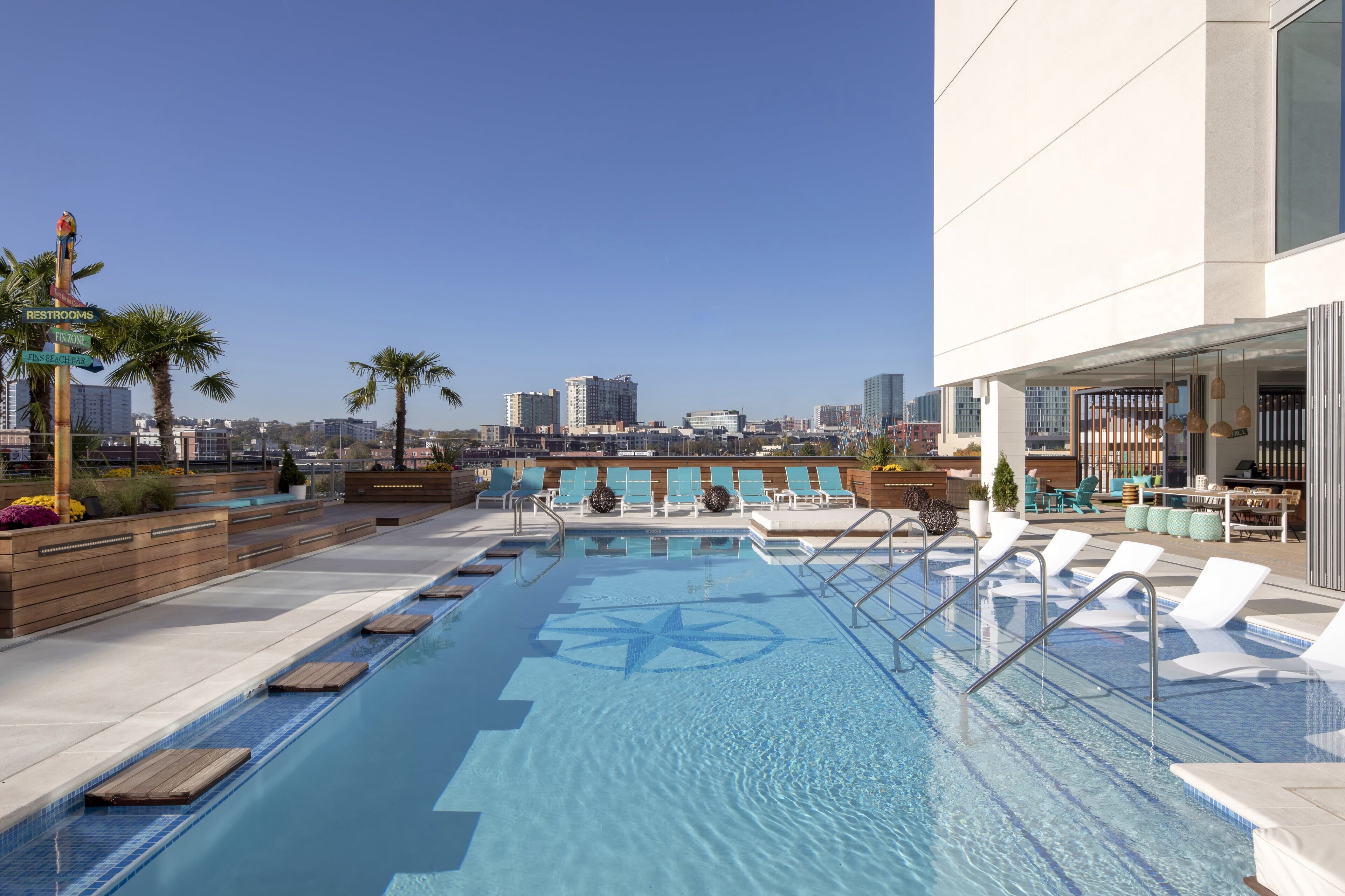 outdoor pool, open 8:00 am to 10:00 pm, pool umbrellas, pool loungers