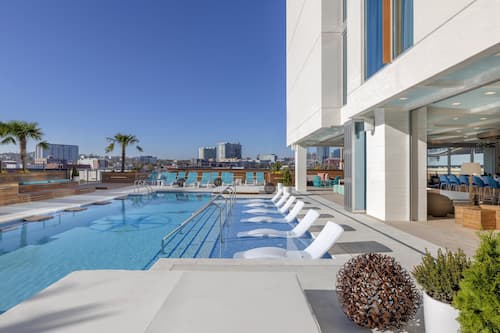 Outdoor pool, open 8:00 AM to 10:00 PM, pool umbrellas, sun loungers