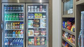 A refrigerated display case with various food items and beverages.