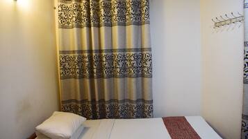 Economy Single Room, 1 Twin Bed, City View (Non AC) | Down comforters, pillowtop beds, desk, soundproofing