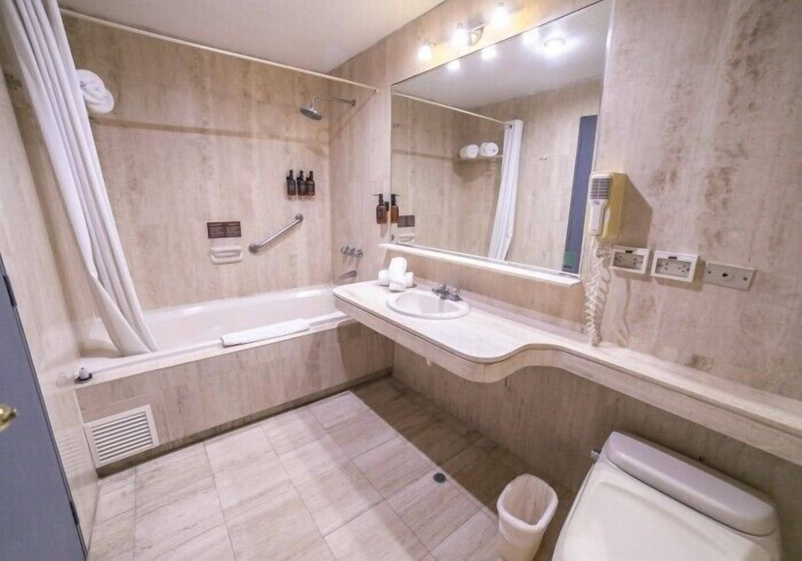 standard twin room, private bathroom | bathroom | rainfall showerhead, soap, shampoo, toilet paper