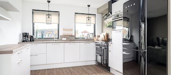 Stay in our spacious Sneekermeer 6 home with private jetty.