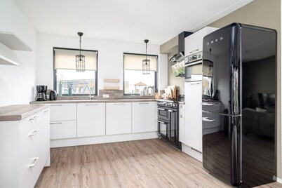 Stay in our spacious Sneekermeer 6 home with private jetty.