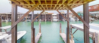 Waterfront home w/ a spacious deck, boat slip, & fish cleaning station - dogs OK