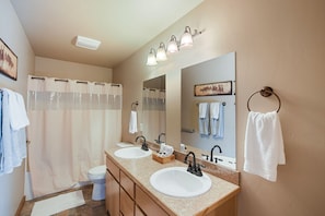 Combined shower/bathtub, hair dryer, towels, soap