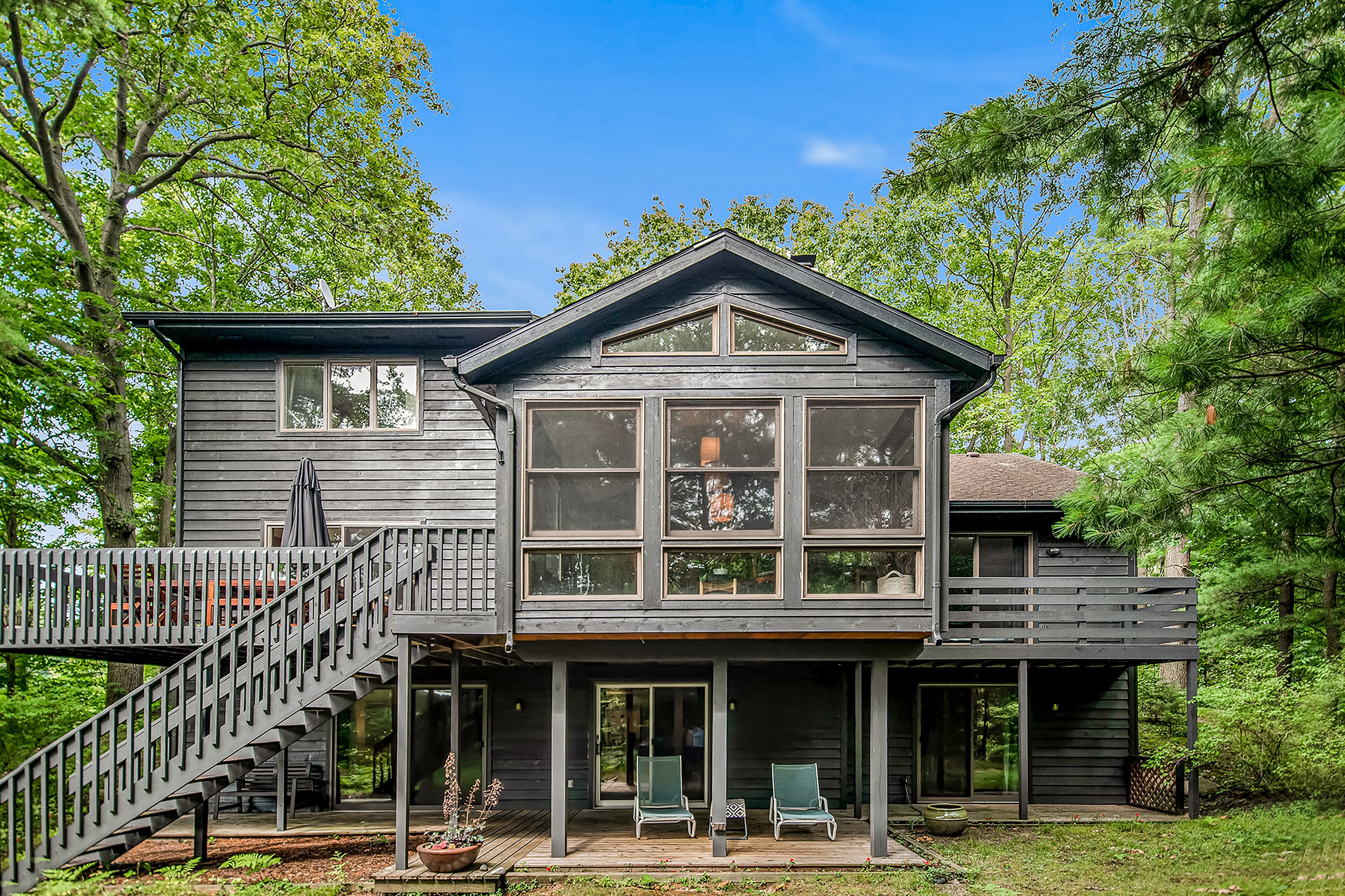 Secluded woodland home w/ a home theater, full kitchen, & marsh views