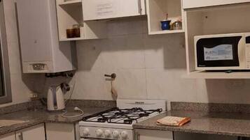 Comfort Apartment | Private kitchen | Full-size fridge, cookware/dishes/utensils