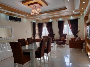 Apartment, 3 Bedrooms, Pool View (A11-13) | Living area | Flat-screen TV - Ramco For Furnished Apartments And Accommodation Compound Leila (New Cairo)