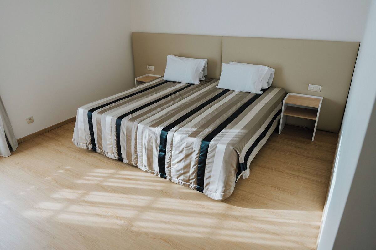 Desk, laptop workspace, blackout drapes, soundproofing