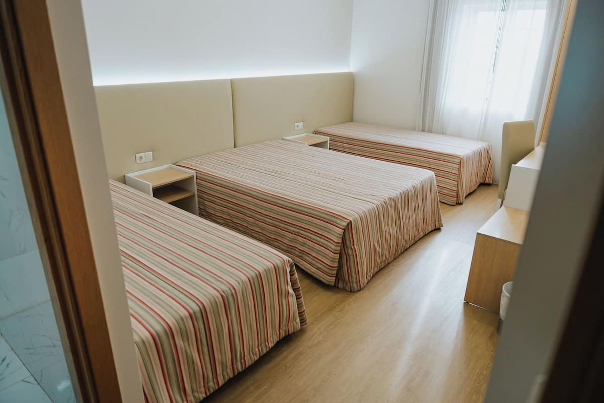 Family Quadruple Room, Multiple Beds, Non Smoking, Private Bathroom | Desk, laptop workspace, blackout drapes, soundproofing