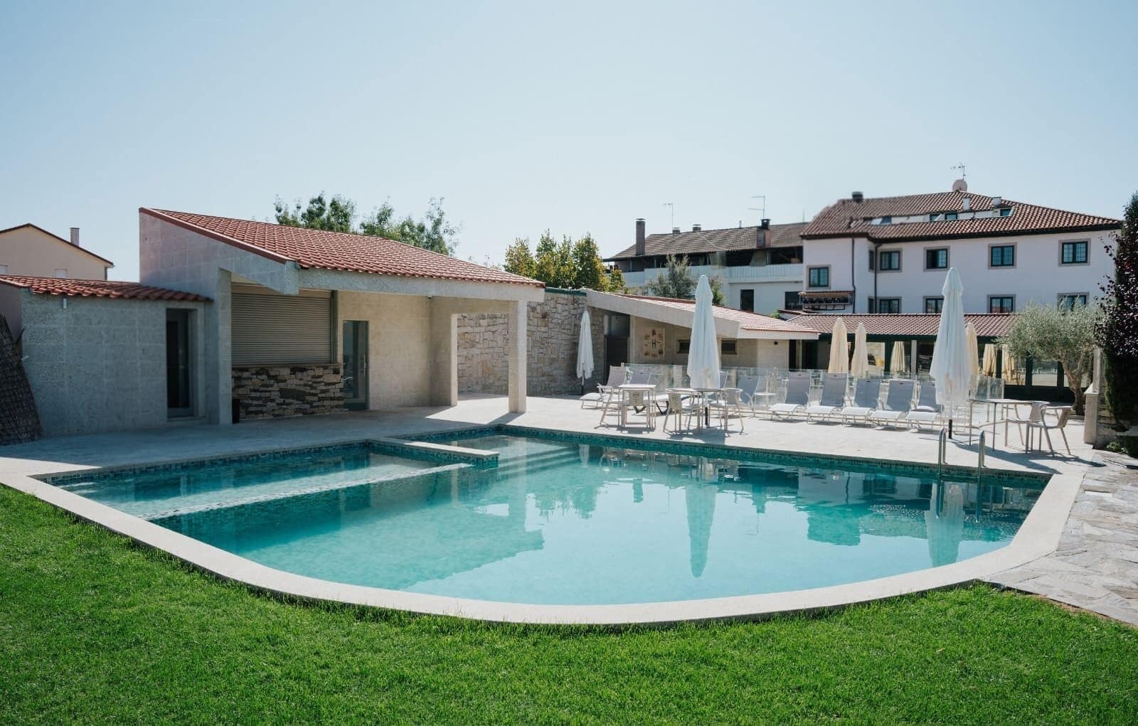 Seasonal outdoor pool, open 9:00 AM to 8:00 PM, pool umbrellas