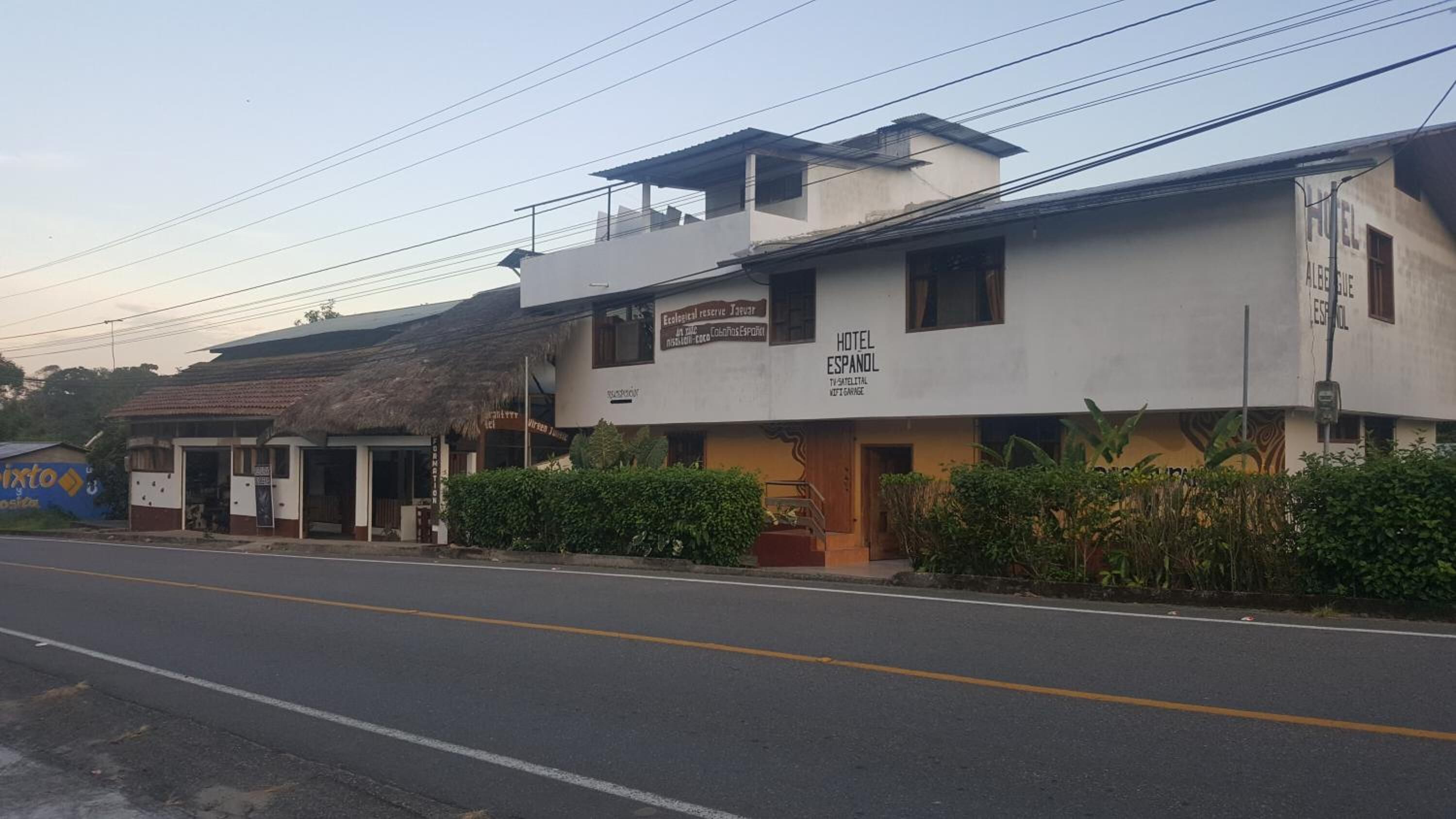 A two-story building with a sign indicating it is a hotel named 'Hotel Español'.