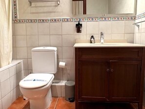 Bathtub, hair dryer, towels, soap