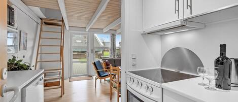 Fridge, stovetop, dishwasher, coffee/tea maker